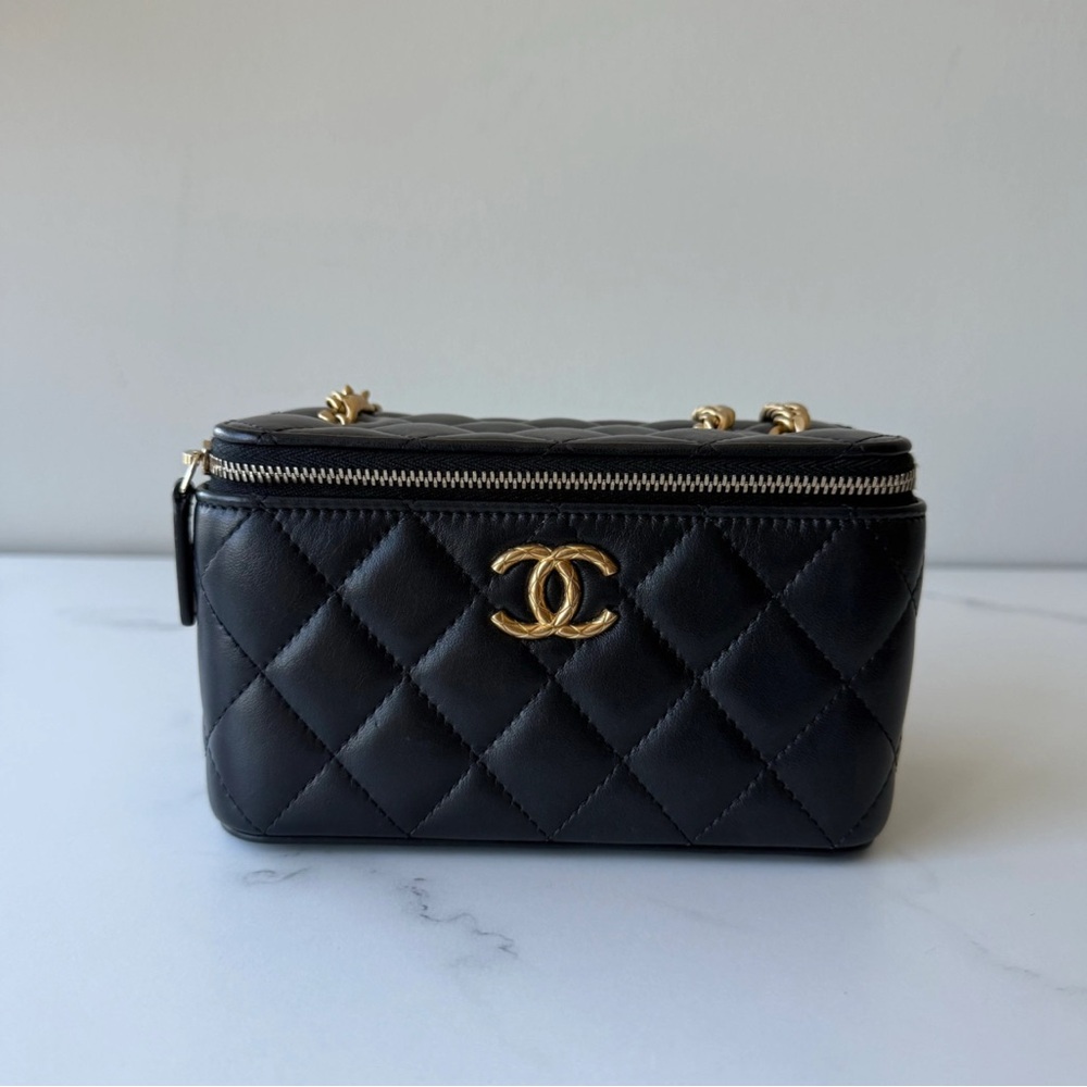 CHANEL Black Quilted Mini Bag with Gold Accents